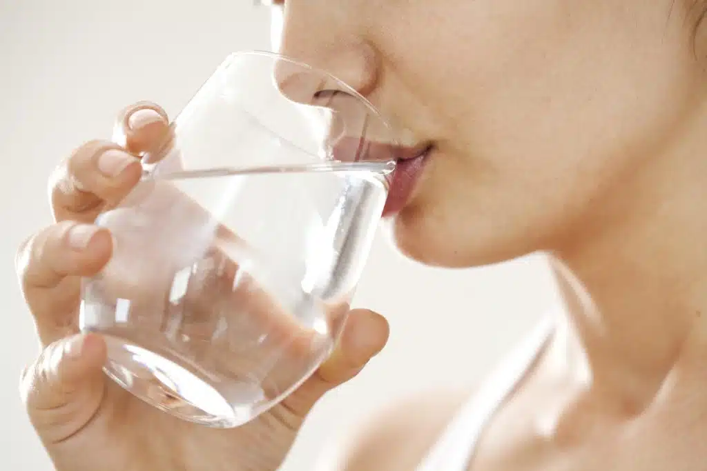 woman drinking glass of water